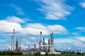 Oil Refinery factory industry with blue sky and clouds.
