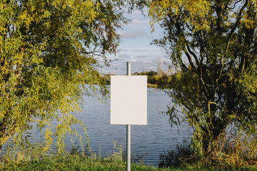 blank sign on the lake. Empty space for text, copy space. Mock up