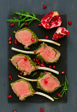 Rack of lamb in herb cheese and breadcrumbs. A festive meal. Selective focus.