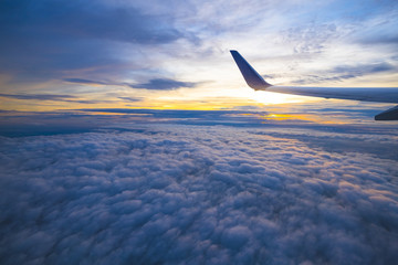 Beautiful view from window of airplane in sunrise sky