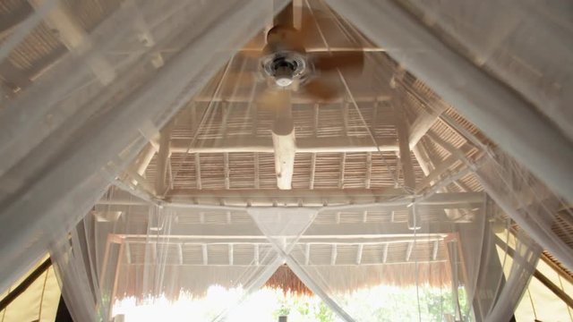WS TU Interior of thatched villa with fan / Indonesia