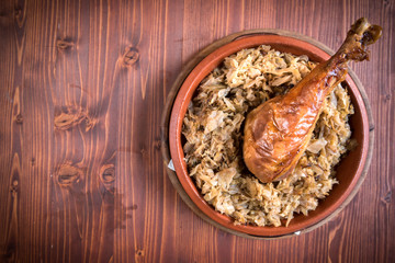 Served turkey drumstick and cabbage