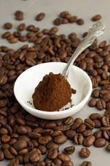 ground coffee, tea spoon and a white plate