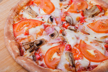 Italian pizza on a wooden background