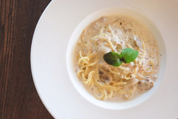 Close up of Spaghetti cream sauce tuna and mushroom in soft vintage tone