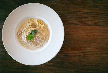 Close up of Spaghetti cream sauce tuna and mushroom in soft vintage tone and copyspace
