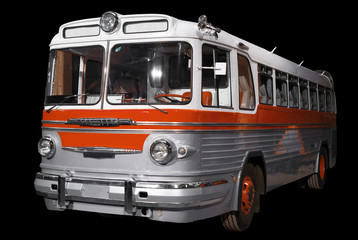 Old retro orange bus. Isolated on black background.