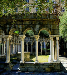 View of the gothic arches of the antique cloister of St. Andrew, Genoa, Italy