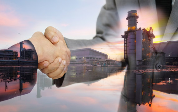 Double exposure of business women double handshake and Electric Generating Factory as Investment in energy concept.