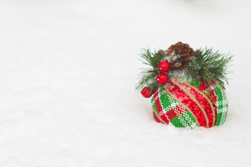 Fototapeta na wymiar Christmas ball in snow