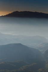 Fototapeta na wymiar Foggy mountain sunrise