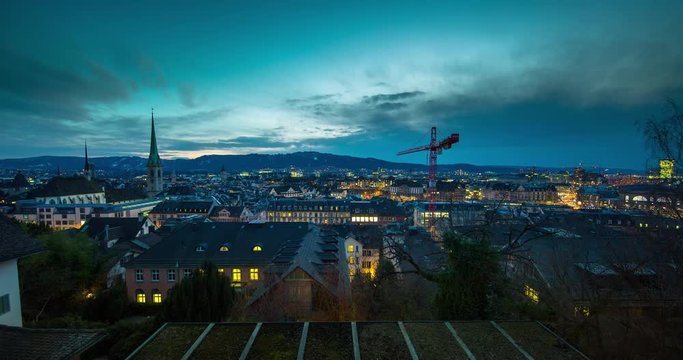 Zurich, Switzerland - view over the rooftops of Zurich from Polyterrace of ETH Zurich at sunset - Timelapse with zoom in - March 2016