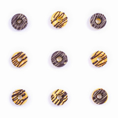 Nine Glased Donuts on the white background. Top view.