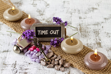 time out concept with burning candles and lavender