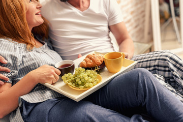Couple having breakfast at home