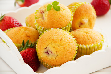 Muffins with fresh strawberries. Selective focus.