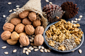 A variety of nuts on a dark background.