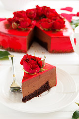 Chocolate and strawberry mousse cake in the shape of heart.