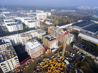 Fototapeta na wymiar Construction site with crane and building - Aerial view