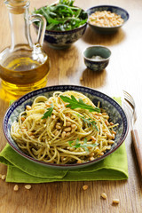 Spaghetti with pesto of arugula with pine nuts.