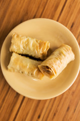 Three baklavas on a plate