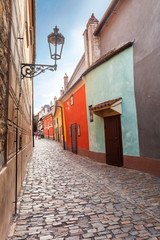 Golden street inside of Old Royal Palace in Prague, Czech Republic. Multicolored houses authentic retro.