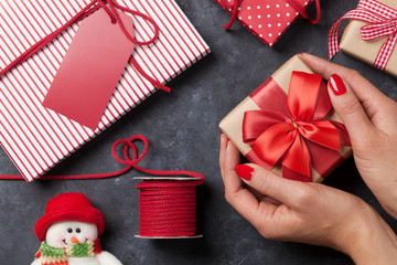 Female hands holding christmas gift