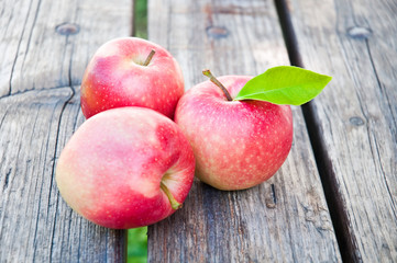 Fresh apples on wooden table