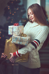 Beautiful Happy Girl with Christmas Gift.Snow