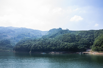 Fototapeta na wymiar The lake and mountains scenery with blue sky