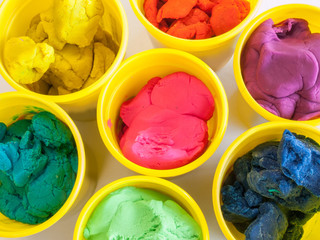 colorful play dough in yellow can © tigercat_lpg
