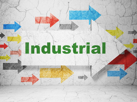 Manufacuring concept: arrow with Industrial on grunge wall background