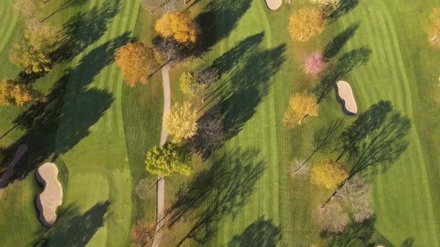 Aerial above Golf Course. Fall season with color trees