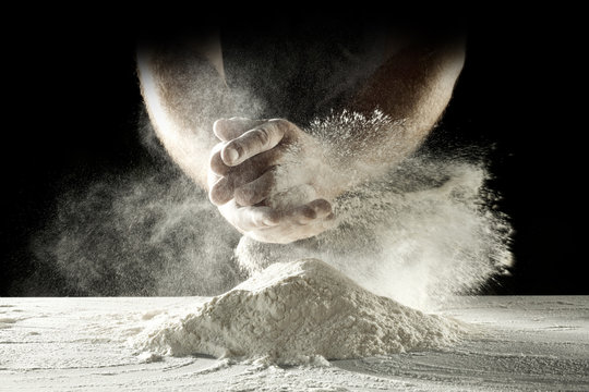 desk of flour and hands 