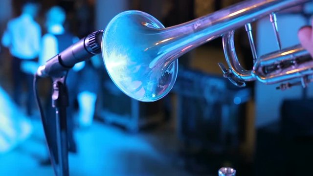 Playing trumpet on the background of a drummer