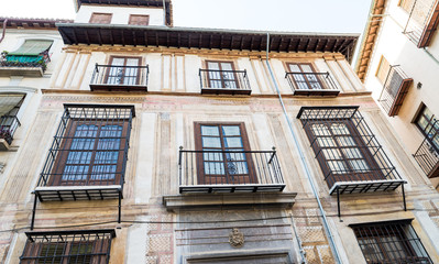 Fototapeta na wymiar Beautiful old balconies and doors in Granada, Spain