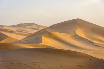 Fototapeta na wymiar Colorful sand dunes in Gobi desert in afternoon sun, Dunhuang, China