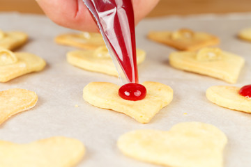Making self-made christmas star cinnamon cookie, closeup, low focus
