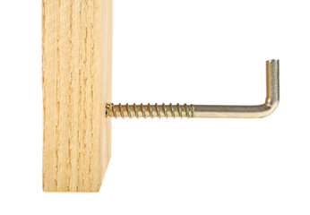 Screw hook screwed into the wooden plank, white background