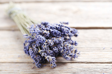 Bunch of lavender flowers on grey wooden background