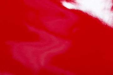 Red glossy leather for background usage.