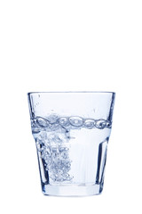 Water pouring in glass isolated on a white