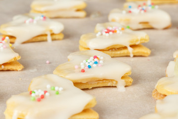 Making self-made christmas star cinnamon cookie, closeup, low focus