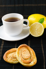 cup of hot black tea, lemon, homemade cookies