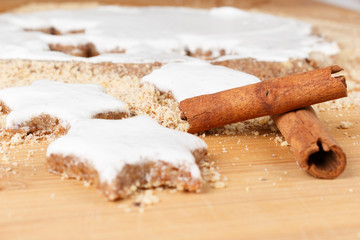 Making self-made christmas star cinnamon cookie, closeup, low focus