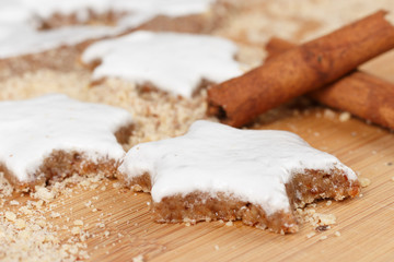 Making self-made christmas star cinnamon cookie, closeup, low focus