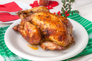 Baked chicken on white plate.