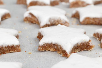 Making self-made christmas star cinnamon cookie, closeup, low focus