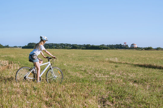 Picture of Young woman ride bicycle