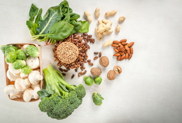 Selection of products with a high content of vegetable protein: broccoli, brussels sprouts, nuts - walnuts, hazelnuts, almonds, peanuts - beans, lentils, chickpeas